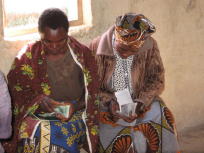 photo of solidarity group members counting their from MuCoBa obtained loan
